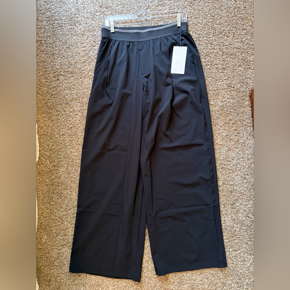 Athleta Stratosphere Black Wide Leg Pants, new w tags. Front pleats. Pockets